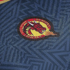 Maglia da allenamento rugby Dragons Catalans con logo del drago rosso.