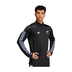 Felpa da rugby All Blacks nera con zip mezza lunghezza e logo Adidas.