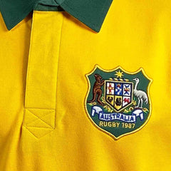 Maglia da rugby vintage dei Wallabies: polo Australia 1987, gialla con colletto verde, con stemma australiano ricamato.