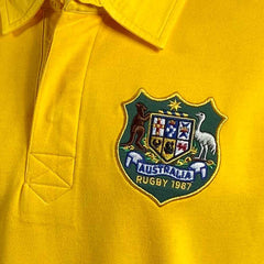 Maglia da rugby vintage dell'Australia del 1987: maglia da rugby gialla con stemma australiano ricamato, ideale per collezionisti e appassionati di rugby.