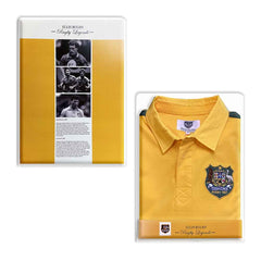 Maglia Rugby Australia Vintage: maglia da rugby australiana del 1987, gialla con finiture verdi, stemma della squadra, presentata in confezione da collezione.