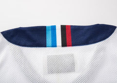 Canottiera Auckland Blues 2025 con dettagli tricolore sul colletto.