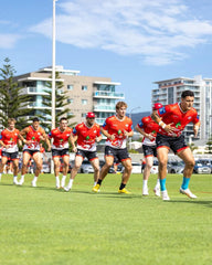 Maglia da rugby per bambini St. George Illawarra Dragons: maglia da rugby rossa per allenamento.