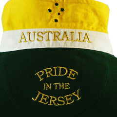 Polo rugby vintage Australia verde con scollo giallo e scritta "Pride in the Jersey".