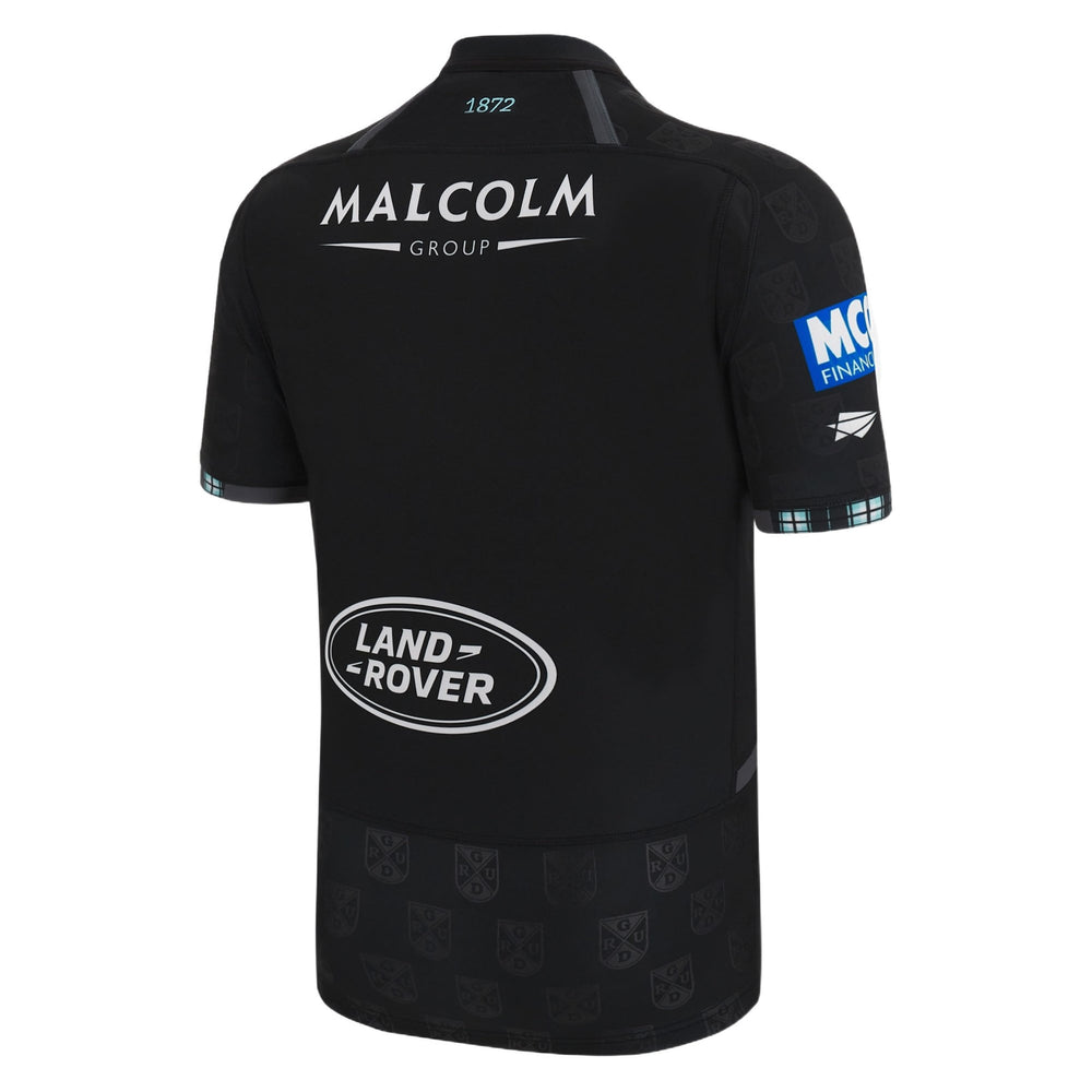 Maglia da rugby casalinga dei Glasgow Warriors Youth 2023: maglia nera con stemma della squadra e loghi degli sponsor.