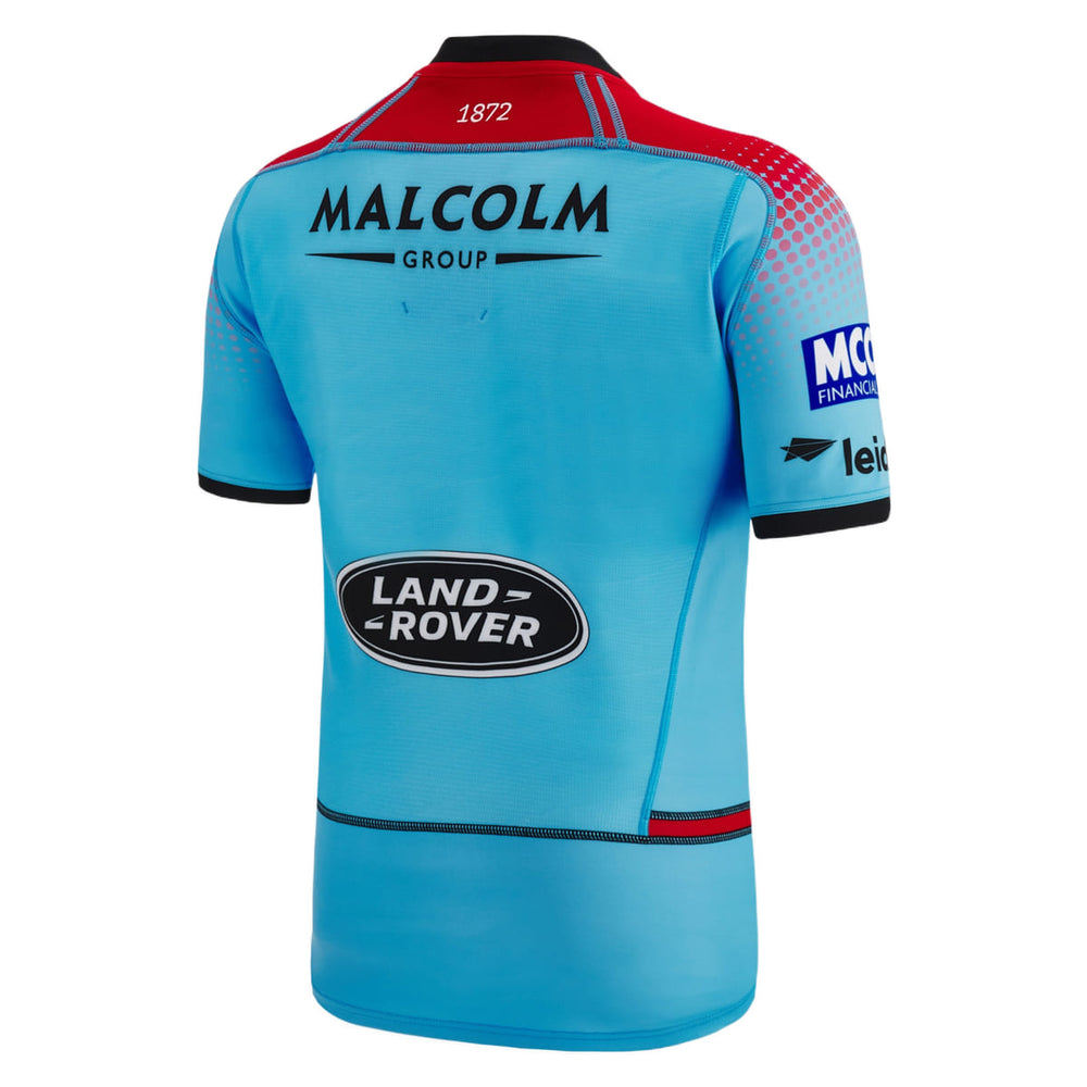 Maglia da rugby autentica da trasferta dei Glasgow Warriors 2023: maglia azzurra, vista posteriore, con loghi degli sponsor in evidenza.