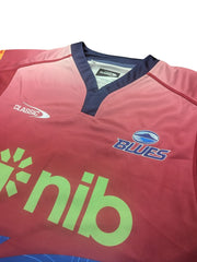 Maglia Rugby Blues Super Rugby Pacific Home TR2 2025 Ragazzo: Maglia da rugby per ragazzi, design sfumato rosso e blu, con logo Blues e sponsor Nib.