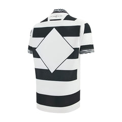Maglia rugby Barbarians home 2026 Macron con design a righe bianche e nere e rombo centrale.