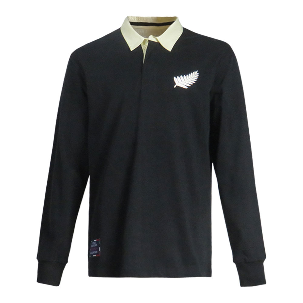 Maglia Rugby Nuova Zelanda Vintage: Maglia da rugby nera a maniche lunghe con stemma della felce All blacks e colletto tradizionale bianco.