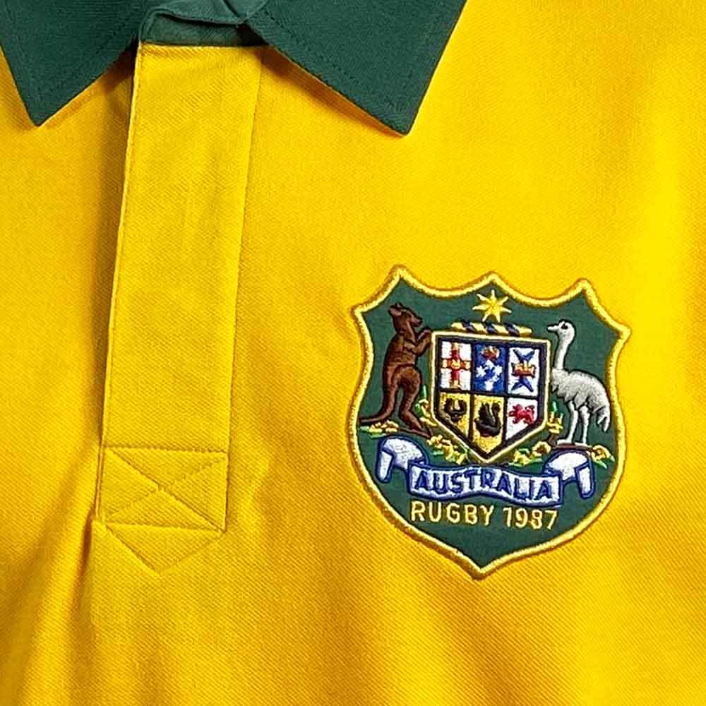 Maglia da rugby vintage dei Wallabies: polo Australia 1987, gialla con colletto verde, con stemma australiano ricamato.