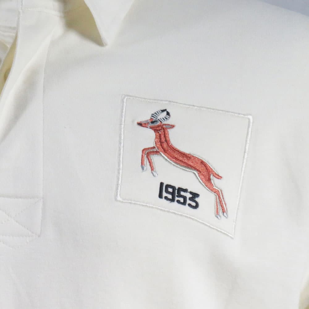 Maglia da rugby vintage del Sud Africa del 1953, bianca, con l'emblema degli Springbok ricamato.