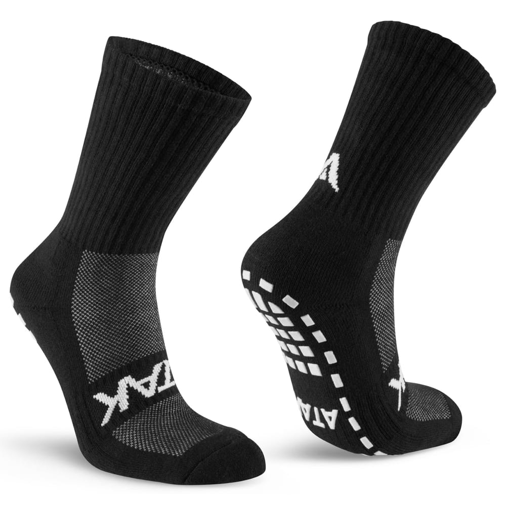 Calze nere CALZA ATAK SHOX MID GRIP con grip antiscivolo e logo bianco.