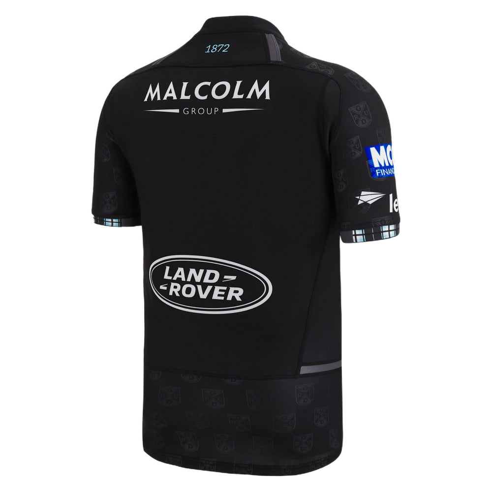 Maglia da rugby autentica Glasgow Warriors 2023 Home: maglia nera con loghi Land Rover e Malcolm Group, caratterizzata da un motivo discreto e dettagli azzurri.