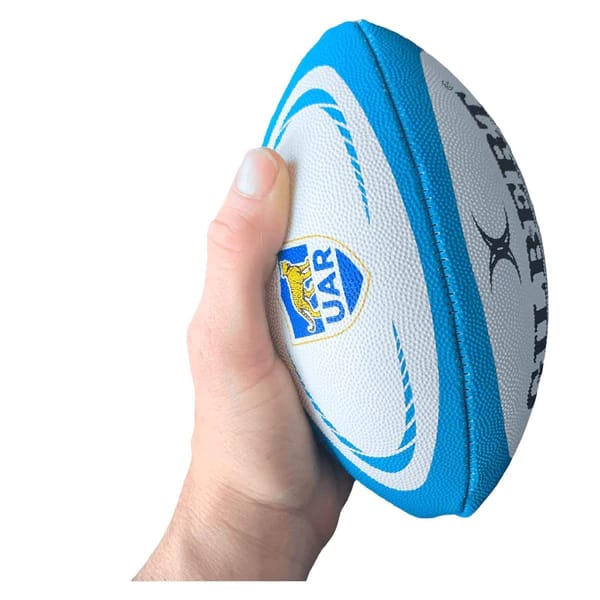 Mini pallone da rugby Argentina Pumas: mini pallone da rugby con licenza ufficiale, bianco con dettagli blu, perfetto per i giovani tifosi.