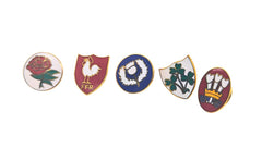 Set di cinque distintivi smaltati delle squadre di rugby: la rosa dell'Inghilterra, il gallo della Francia, il cardo della Scozia, il trifoglio dell'Irlanda e i porri del Galles.